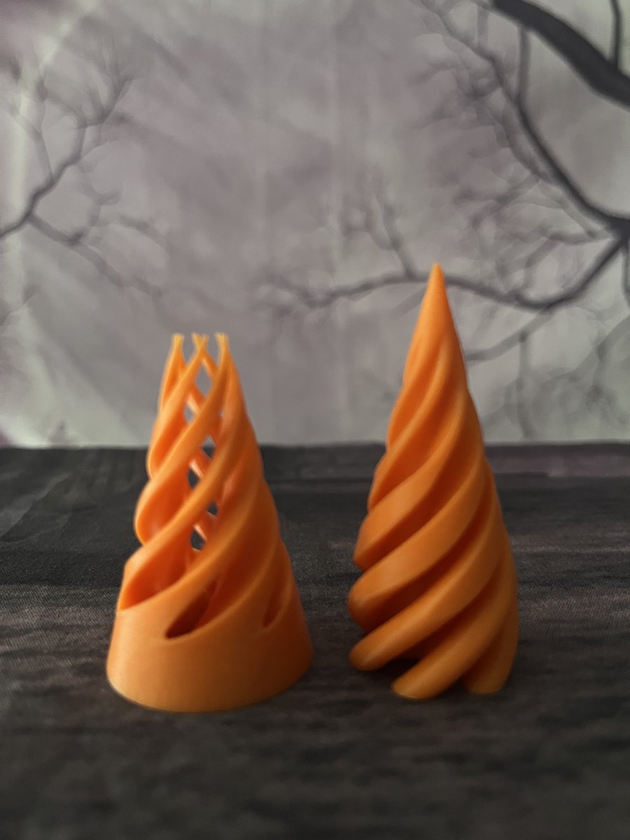 Orange Impossible Spiral Cone Fidget shown in two interlocking pieces