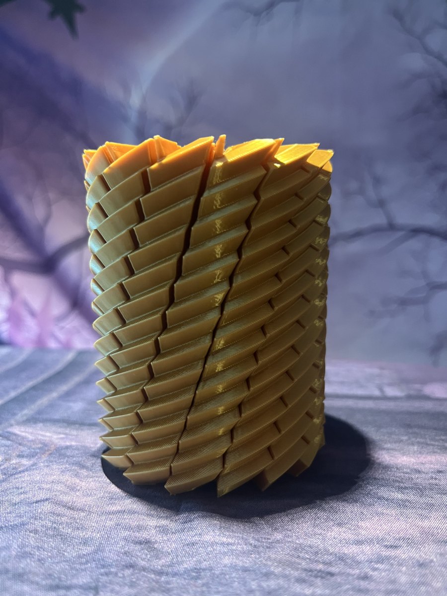 Gold Spiral Twist Expanding Fidget standing upright